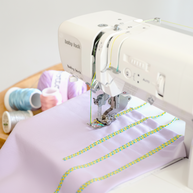 Baby Lock PRIMO con Punto di Copertura Creativo con Infilatura Elettronica