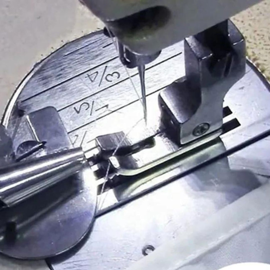 Piedino orlatore per macchina industriale piega tessuto